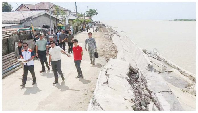 Julian_1_resized President Ferdinand Marcos Jr. (third from left) and his son, Ilocos Norte’s Cong. Sandro Marcos, inspect the Gabu Dike that was damaged by Supertyphoon “Julian.” PPA POOL