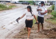 Mexico counting dead from ‘zombie storm’ John A woman and a man holding a baby walk barefoot on a muddy street in Acapulco, Guerrero, Mexico. Many families had to seek safety in shelters after their homes were flooded. REUTERS