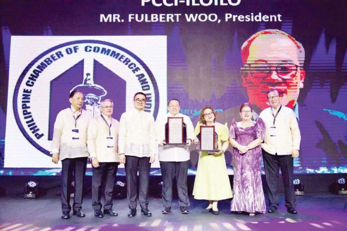PCCI_pic_resized The Philippine Chamber of Commerce and Industry (PCCI) Iloilo bagged the Best Tourism Advocacy Award and Most Outstanding Chamber during the 50th Philippine Business Conference (PBC). PCCI Iloilo President Engr. Fulbert C. Woo (fourth from left) and PCCI-Visayas AVP Melanie Ng (fifth from left) accepted the awards. Also in photo are (from left) Dr. Alberto Fenix Jr., MOCA 2024 chairman; Raymund Jude Aguilar, 50th PBC & E chairman; Frederick Go, Special Assistant to the President for Investment and Economic Affairs; Consul Enunina Mangio, PCCI president; and George Barcelon, 50th PBC Awards Committee chairman.