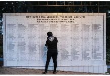 Author to go on trial for downplaying Rwanda genocide A woman stands in front of a memorial of list of names of people killed during the 1994 Genocide against the Tutust at Nyanza Genocide Memorial Centre in Kigali in April 2024. AFP