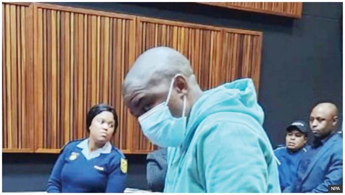 South-Africa-1 Nkosinathi Phakathi wears a facemask and blue tracksuit during his sentencing at the Johannesburg High CourtN. The judge agreed that Phakathi had shown “no remorse and was beyond rehabilitation,” prosecutors said. NPA