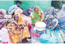 Sudanese, displaced from the Gezeira district, arrive in the eastern city of Gedaref on October 26. Escalating conflict in Gezira has forced civilians to flee. GETTY IMAGES