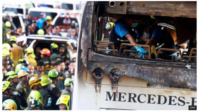 Thailand Thai forensic police officers inspect a burnt bus on Vibhavadi Rangsit road in Bangkok, Thailand. EPA