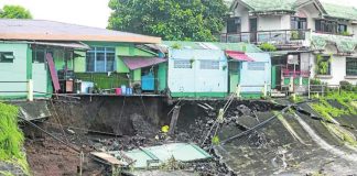 Heavy rains and strong winds brought by Severe Tropical Storm Kristine trigger a landslide and massive flooding on the riverside of Barangay San Francisco, Guinobatan, in Albay, forcing many residents to flee to evacuation centers. MARK ALVIC ESPLANA, PHILIPPINE DAILY INQUIRER