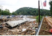 Nearly 100 still missing in N. Carolina after hurricane A damaged walkway - partially twisted onto its side - lies on top of debris left by Hurricane Helene in North Carolina. The walkway lies over a lake, with a road also pictured to the right of the lake. GETTY IMAGES