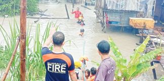 Personnel of the Bureau of Fire Protection (BFP) – Bacolod City rescued families affected by flooding in Bag-ong Dalan, Barangay Sum-ag on Monday morning, October 21, 2024. BFP-BACOLOD CITY PHOTO