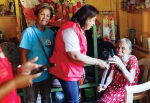 Remedios Chavez (right) receives a walking cane from Mayor Raymund Tongson for her 89th birthday. Photo also shows senior citizens focal person Norma Pelayo (second from right) of the Himamaylan City Social Welfare and Development Office handing over the cane to Chavez. CITY GOVERNMENT OF HIMAMAYLAN PHOTO