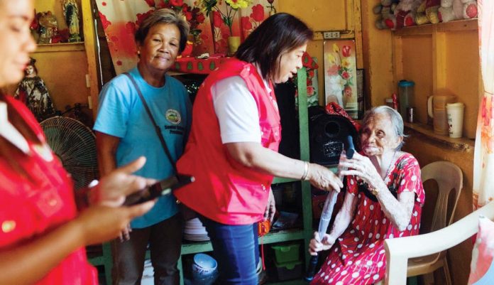 birthday_gift_1_resized Remedios Chavez (right) receives a walking cane from Mayor Raymund Tongson for her 89th birthday. Photo also shows senior citizens focal person Norma Pelayo (second from right) of the Himamaylan City Social Welfare and Development Office handing over the cane to Chavez. CITY GOVERNMENT OF HIMAMAYLAN PHOTO