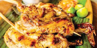 Bacolod chicken inasal was ranked No. 1 by TasteAtlas on the Top 100 Filipino dishes. This dish is typically served with annatto-flavored garlic rice and spiced vinegar, making it a well-loved staple in Filipino cuisine. PHOTO COURTESY OF LEONESNAPOLEONES.COM