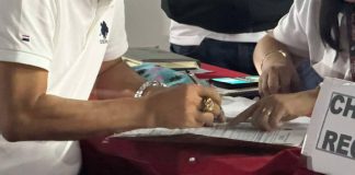 Photo shows a person filing a certificate of candidacy (COC).