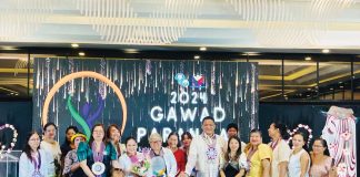 Ma. Ninfa Desiree Segovia of Tambisaan, Barangay Manoc-manoc, Malay, Aklan receives her P50,000 cash prize and a plaque of recognition as regional winner in the 2024 Search for Outstanding Rural Women (SORW) of the Department of Agriculture Region 6.