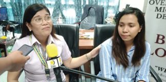 Iloilo Public Employment Service Office acting head Cynthia Parcon-Dario (left) consoles repatriated overseas Filipino worker Donna Jean Gabasa-Berniz from Lebanon.