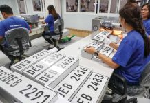 Staff workers operate a hot-foil printing machine as they produce plate numbers at the Land Transportation Office plate-making plant/assembly line in its headquarters in Quezon City. JONATHAN CELLONA/ABS-CBN NEWS PHOTO
