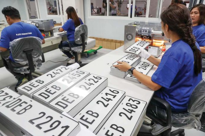 license_plates_resized Staff workers operate a hot-foil printing machine as they produce plate numbers at the Land Transportation Office plate-making plant/assembly line in its headquarters in Quezon City. JONATHAN CELLONA/ABS-CBN NEWS PHOTO