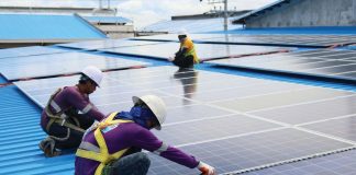 The Federation of Free Workers and Employers Confederation of the Philippines signed an agreement pushing for a transition from fossil fuel and coal to renewable energy while respecting workers' rights. Photo shows workers installing solar panels. POWERPHILIPPINES.COM PHOTO