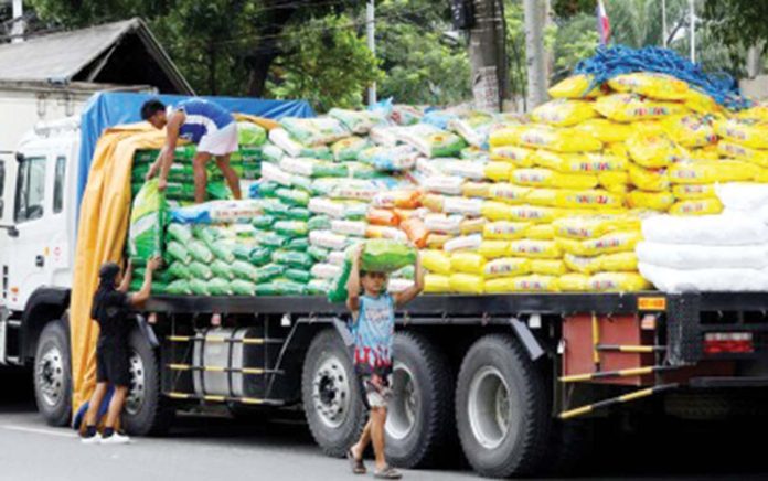 rice_imports_resized Workers move sacks of rice to another truck along Dagupan Street in Tondo, Manila on Sept. 9, 2024. Agriculture Assistant Secretary Arnel De Mesa said Wednesday, Oct. 2, 2024, rice imports may surpass last year’s volume to supplement the country’s strong harvest and maintain a stable rice supply in the country. PNA PHOTO BY YANCY LIM