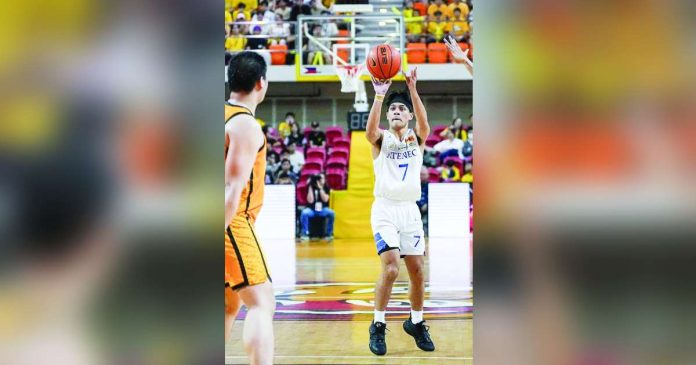 sports Ateneo 1_superimposed Ilonggo Ian Espinosa of Ateneo de Manila University Blue Eagles pulls up for a three-pointer. UAAP PHOTO