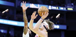 Golden State Warriors’ Brandin Podziemski shoots over the defense of New Orleans Pelicans’ Brandon Ingram. PHOTO COURTESY OF JED JACOBSOHN/AP