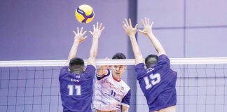 D’Navigators-Iloilo’s Edward Camposano scores against two PGJC Navy Sealions defenders. PHOTO COURTESY OF SPIKERS’ TURF