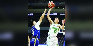 College of St. Benilde Blazers’ Jhomel Ancheta attempts a one-hander against a Jose Rizal University Heavy Bombers’ defender. PHOTO COURTESY OF NCAA/GMA SPORTS