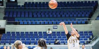 Ilongga Ana Tacatac of the University of Santo Tomas Growling Tigresses attempts a three-point shot. UAAP PHOTO