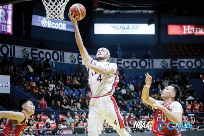 sports_Letran_resized_resized Colegio de San Juan de Letran Knights’ Bryan Santos scores on a layup. PHOTO COURTESY OF NCAA/GMA SPORTS