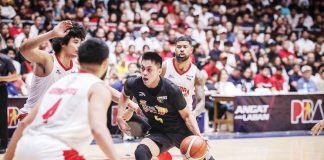 TNT Tropang Giga’s Rey Nambatac tries to score against the defense of Barangay Ginebra San Miguel Kings’ Japeth Aguilar. PBA PHOTO