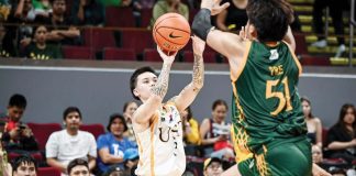 University of Santo Tomas Growling Tigers’ Kyle Paranada pulls up for a three-pointer against the defense of Far Eastern University Tamaraws’ Veejay Pre. UAAP PHOTO