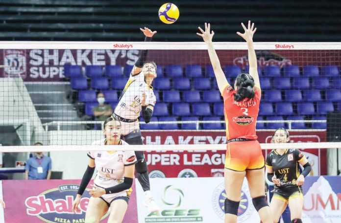 sports_UST_resized University of Santo Tomas Golden Tigresses’ Angeline Poyos goes for an attack. SSL PHOTO