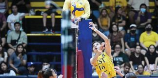 Negrense Cassie Carballo of the University of Santo Tomas Golden Tigresses attempts a drop ball. PHOTO COURTESY OF V-LEAGUE