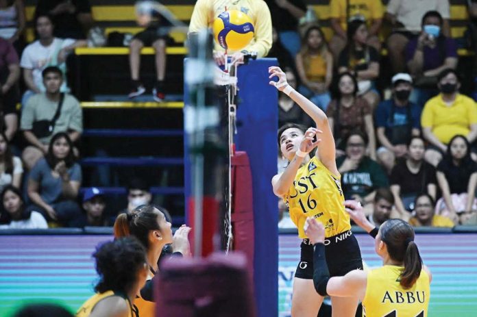 Negrense Cassie Carballo of the University of Santo Tomas Golden Tigresses attempts a drop ball. PHOTO COURTESY OF V-LEAGUE