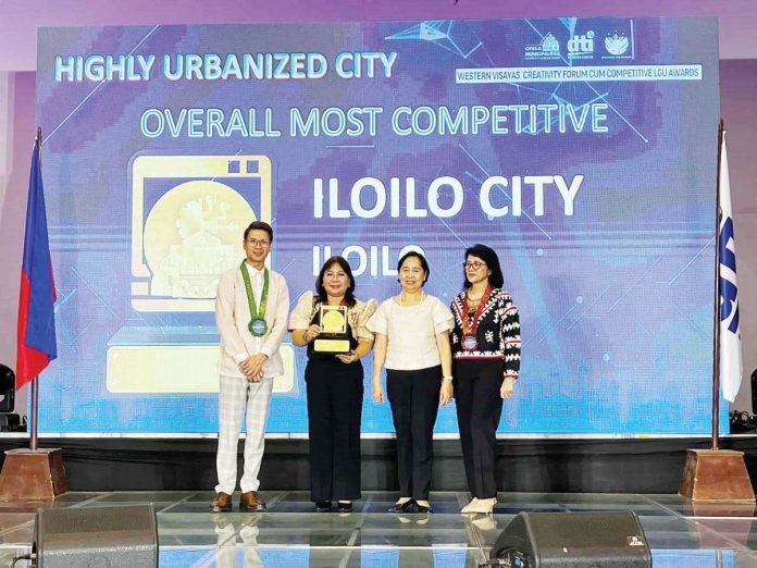 DTI_pic_1_resized Iloilo City was hailed as the “Overall Most Competitive” highly urbanized city by the Department of Trade and Industry (DTI) Region 6. Photo shows Velma Jane Lao (second from left), head of the city’s Local Economic Development and Investment Promotion Office, receiving the award. Also in photo are Jo-Dann N. Darong, Assistant Director of the Bureau of Competitive Development, DTI-6 director Rachel Nufable and DTI-Iloilo director Ma. Dinda R. Tamayo. DTI-6 PHOTO