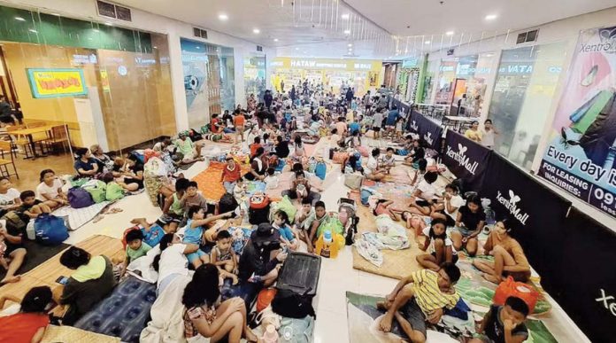 NDRRMC_1_resized Typhoon Pepito (international name: Man-yi) hit the Bicol Region over the weekend, prompting locals to take shelter in a mall. Photo from Barangay Ubaliw / Facebook