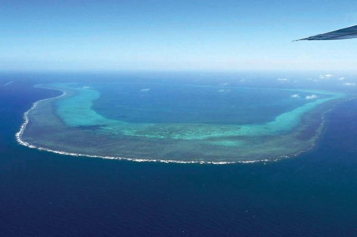PH_1_resized This photo taken on February 15, 2024, shows an aerial view of the Scarborough Shoal in the West Philippine Sea. Photo by JAM STA ROSA / AFP