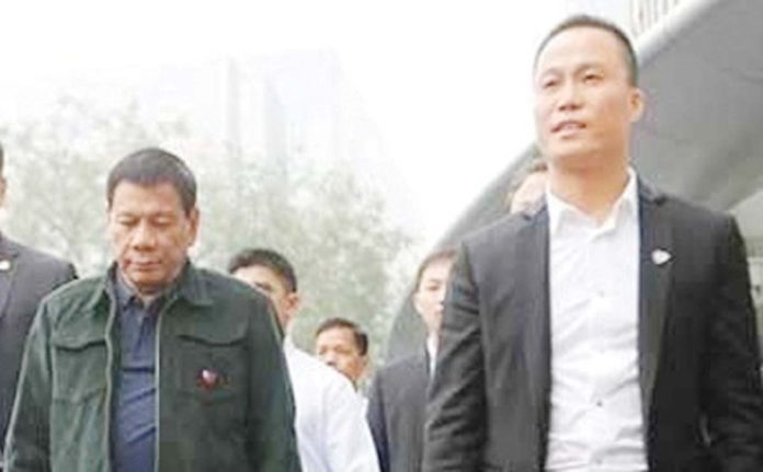 Yang-1 This undated photo shows then President Rodrigo Duterte with his economic adviser, the Chinese national Michael Yang.