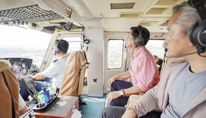 flood-control President Ferdinand Marcos Jr. and Interior and Local Government Secretary Jonvic Remulla are on board a chopper to conduct an aerial inspection of storm-affected areas in Batangas, Cavite and Laguna. Photo from the Presidential Communications Office’ Facebook page