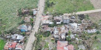 Damaged houses dot the national highway in Northern Iloilo after super typhoon Yolanda struck on November 8, 2013. Yolanda (international name: Haiyan) is considered one of the most destructive typhoons in history. PN