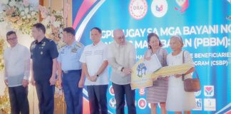 First Lady Louise “Liza” Araneta-Marcos hands over a symbolic house key to a family member of a fallen uniformed personnel during the “Pagpupugay sa mga Bayani ng Bansang Makabayan: An Assembly and Thanksgiving with the Beneficiaries of the Comprehensive Social Benefits Program (CSBP)” on Nov. 20, 2024 in Iloilo City. PHOTO FROM PIA WESTERN VISAYAS FACEBOOK PAGE 