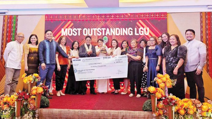 ime-health-system-1 Iloilo Province’s Most Outstanding Local Government Unit (LGU) award for improved health outcomes and robust local health systems from the Department of Health (DOH) - Western Visayas is being received by Iloilo Provincial Health Office (IPHO) head Dr. Maria Socorro Colmenares- Quiñon, Provincial Health Officer I Dr. Wendel Tupas-Marcelo, Dr. Rodney Labis of IPHO’s Health Service Delivery Division, and League of Municipalities of the Philippines (LMP) – Iloilo Chapter president Mayor Rosario Mediatrix Fernandez of San Enrique town. PHOTO FROM DR. WENDEL TUPAS MARCELO FACEBOOK PAGE