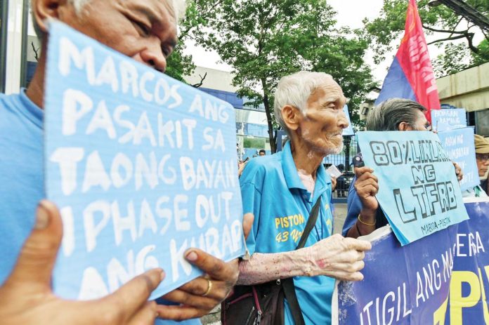 Public Utility Vehicle operators gather outside the Land Transportation Franchising and Regulatory Board Central Office in Quezon City on Aug. 27, 2024, to file petitions and affidavits seeking to withdraw from the government-mandated consolidation program. MARIA TAN/ABS-CBN NEWS PHOTO