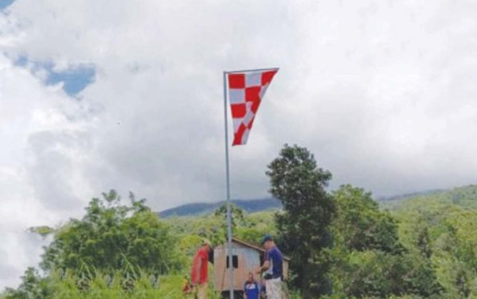 kanlaon_1_resized The first flag marking the four-kilometer radius of the permanent danger zone around Mt. Kanlaon was installed in the area of Barangay Biak na Bato, La Castellana, Negros Occidental on Oct. 16, 2024. More flags will be installed along the demarcation points in the coming months, the Office of Civil Defense in Western Visayas said. PENRO-NEGROS OCCIDENTAL PHOTO