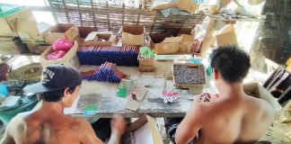 Young men make f irecrackers somewhere in Iloilo City’s Arevalo district which is traditionally deemed the “firecracker capital” of Iloilo. The Department of Health in Western Visayas is discouraging people from setting off f irecrackers to celebrate the holidays, calling it a hazardous practice.