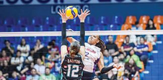 Choco Mucho Flying Titans’ Cherry Nunag smashes the ball against the defense of Galeries Tower Highrisers’ Roselle Baliton. PVL PHOTO
