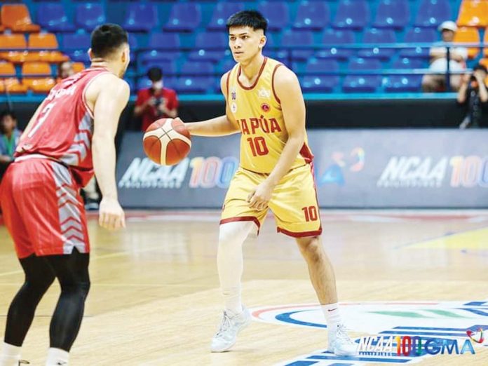 sports-Cuenco National University Bulldogs’ Jolo Manansala gestures after making a three-point shot. UAAP PHOTO
