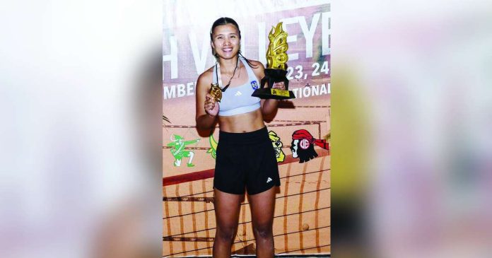 sports NU 1_superimposed Negrense Honey Grace Cordero of the National University Lady Bulldogs displays her MVP trophy. UAAP PHOTO
