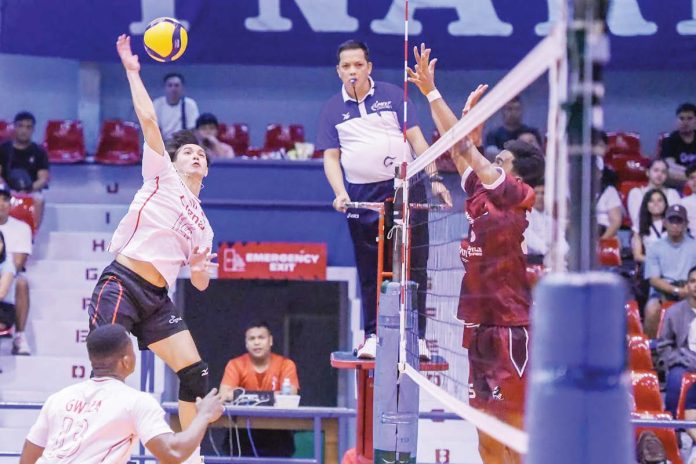 sports-Spikers D’Navigators-Iloilo’s Vince Abrot tries to score against a Cignal HD Spikers’ defender. PHOTO COURTESY OF SPIKERS’ TURF