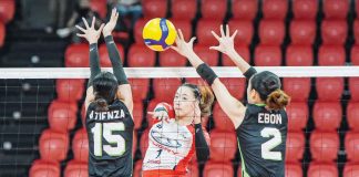 Ilongga Princess Anne Robles of Chery Tiggo Crossovers smashes the ball against two defenders. PVL PHOTO