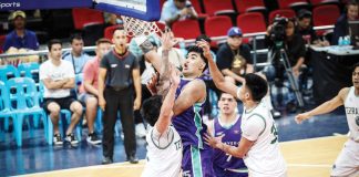 Converge FiberXers’ Justin Arana attacks the defense of Terrafirma Dyip’s Mark Sangalang for an inside hit. PBA PHOTO