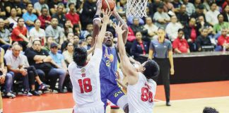 TNT Tropang Giga’s Rondae Hollis-Jefferson shoots against the defense of Barangay Ginebra San Miguel Kings’ Ralph Cu and Benedict Adamos. PBA PHOTO