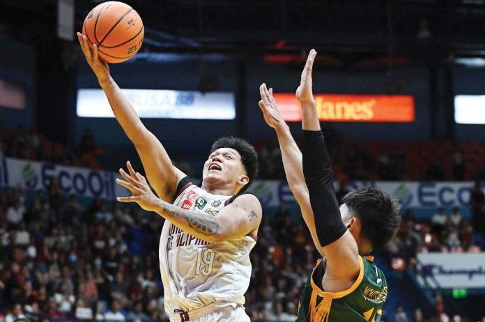 Ilonggo Gerry Abadiano of University of the Philippines Fighting Maroons stretches for a layup. UAAP PHOTO